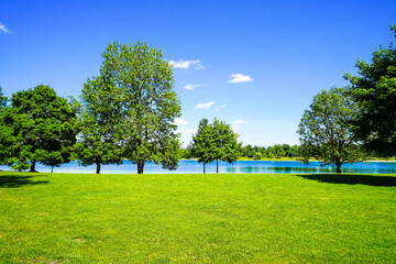 View of Lake Karsfeld and the surrounding landscape. Nature by the lake near Karsfeld in Upper Bavaria.
