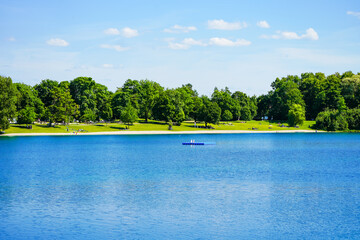 View of Lake Karsfeld and the surrounding landscape. Nature by the lake near Karsfeld in Upper Bavaria.
