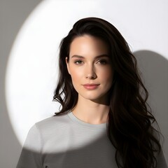 Young woman with dramatic lighting and shadow on face