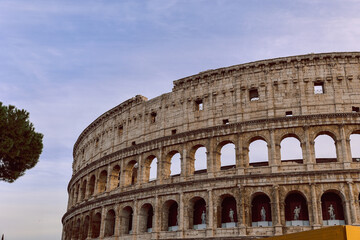 Fototapeta premium Panoramic view of old Colosseum in Rome. Beautiful popular of ancient landmark. Famous card of city of Rome, Italy