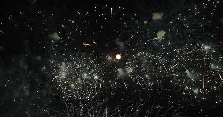 Celebration greeting Beautiful fireworks colorful fireworks on the beach for abstract background , anniversary, celebration , 4th of July independence day and new year background or wallpaper. - Powered by Adobe