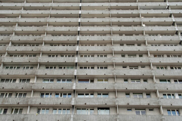 Concrete apartment block facade with repetitive balconies — urban residential architecture