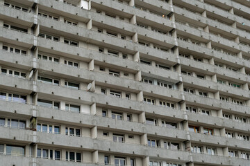 Concrete apartment block facade with repetitive balconies &mdash; urban residential architecture