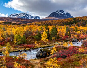 Vibrant autumn foliage beside a winding stream and mountains