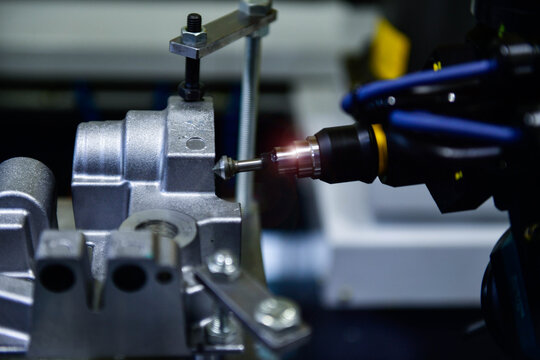 Spindle cutting tool Rotary 5-axis CNC milling machine during deburring of engine parts, heavy industry plan	