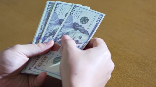 Fanning and Refanning USD Bills by Hand Over Tabletop