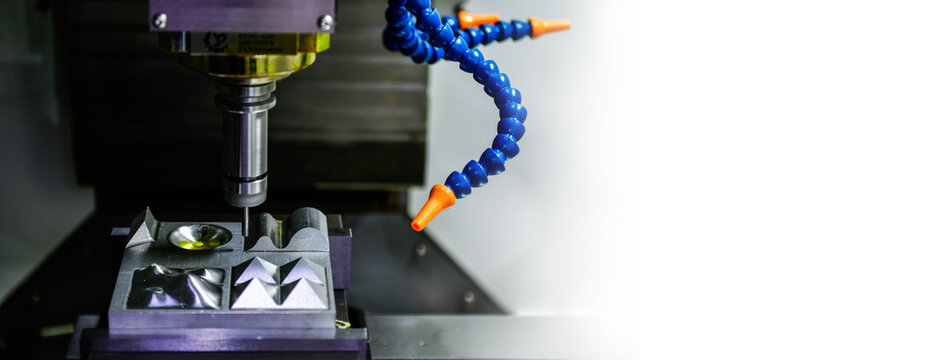 Spindle cutting tool Rotary 5-axis CNC milling machine during deburring of engine parts, heavy industry plan, copy space	