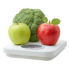 A white scale with a green apple and a red apple on it