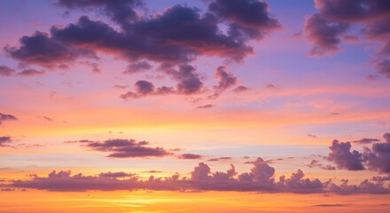 A vibrant sunset paints the sky with swirling hues of orange, pink, and purple clouds