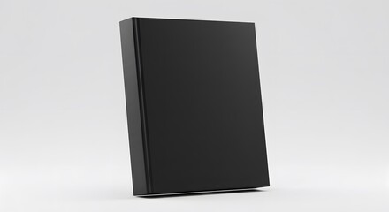 Black hardcover book leaning against white background, perspective view, modern, minimalist