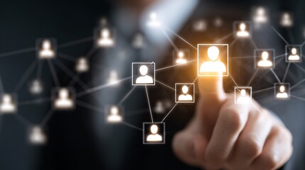 Close-up of hand selecting glowing digital business network connection icons