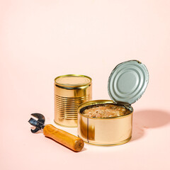 Open and Closed Golden Cans of Preserved Food with Can Opener
