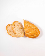 Freshly Sliced Rustic Bread or Baguette on a White Background