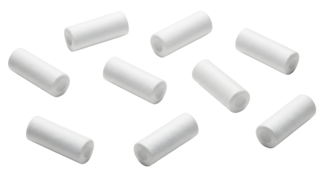 Multiple Small White Cylindrical Filters or Plugs Isolated on Clean White Background
