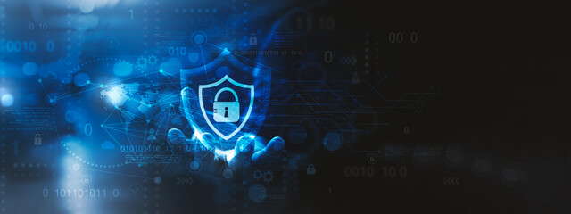 Global Cybersecurity Protection Network, A futuristic cybersecurity concept image featuring a glowing shield with a lock icon, symbolizing digital protection and data security. 
