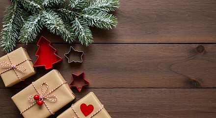 Christmas gifts and cookie cutters on rustic wooden background present craft