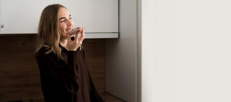 woman recording voice messages talking on speakerphone using smartphone. voice assistant on mobile phone