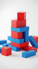 Obraz premium Colorful red and blue building blocks stacked and scattered on a clean white background.