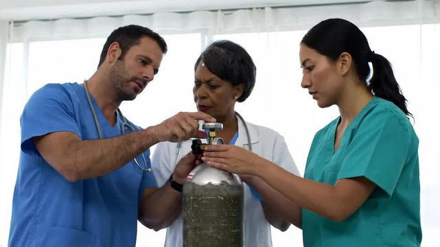 A diverse team of healthcare professionals, including doctors and nurses, collaborating during a training session on using an oxygen tank - Powered by Adobe