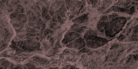 Close-up overhead view of turbulent dark brown water with frothy white foam and intricate bubble patterns creating a dynamic and textured surface for abstract concepts