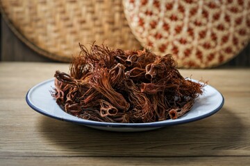 Close up of dried red cotton tree flowers (Kapok flowers) Heap of dried Dok Ngiew , Northern Thai food ingredient.
