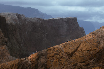 Dramatic volcanic cliffs and serene ocean view at Ponta de S&atilde;o Louren&ccedil;o, Madeira Island, Portugal &ndash; panoramic coastal landscape with sailboats, hiking trails, and wild natural beauty.