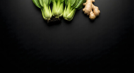 Fresh Chinese vegetables: Bok Choy and ginger on black background.