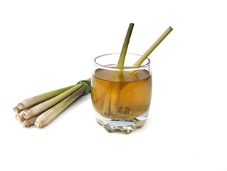 Lemongrass boiled water in glass with fresh lemongrass. Herbal drink. High angle view	