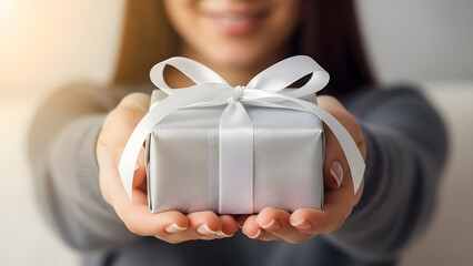 Gift of Giving: A gesture of generosity and thoughtfulness, a person extends a beautifully wrapped gift. A tangible symbol of connection and warmth.