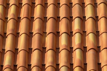 Closeup view of traditional clay roof tiles in warm sunlight