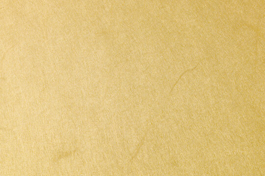 上品な光沢を持つ黄金色の和紙の背景素材　Washi Paper Background Texture with Golden Shine Japanese Style Luxury