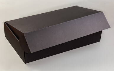 Black rectangular cardboard box with slightly open lid
