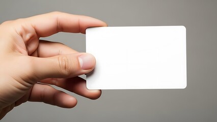 Fototapeta premium Hand holding blank white card for custom text or logo display