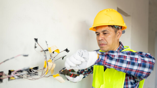 Electrical work in progress electrician prepares wiring indoor setting professional action focused viewpoint home improvement concept - Powered by Adobe