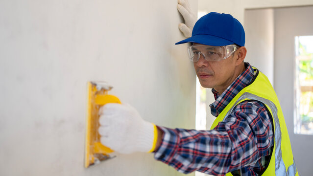 Home renovation action construction site professional worker indoor space close-up view craftsmanship skills for effective results