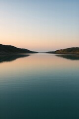 Fototapeta premium Hill lake under a quiet evening
