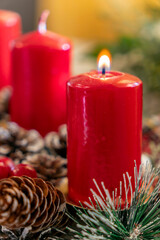Candles and pinecones create a festive atmosphere during the holiday season at a cozy gathering