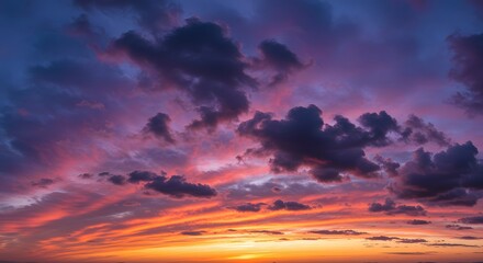 Stunning image showcasing a vibrant sunset with vivid orange, purple and blue hues illuminating the sky