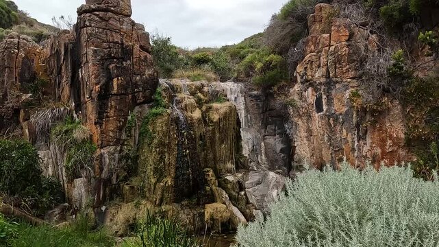 Quinninup Falls, Seasonal Waterfall Cascading Over Orange Granite Cliffs on the Western Australia Coastal Hike