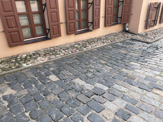 Abstract background. Old cobblestone pavement closeup