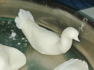 Hand sculpted White Dough Bird Figure on a Metal Plate