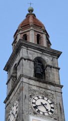 Historic Swiss clock tower rising against clear blue sky