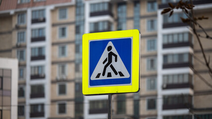 pedestrian crossing sign on the street