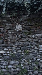 Rustic stone and pebble wall texture in natural rock garde