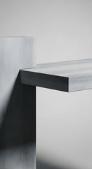 Abstract close-up of a modern, minimalist table or shelf with clean lines and geometric shapes against a plain background.