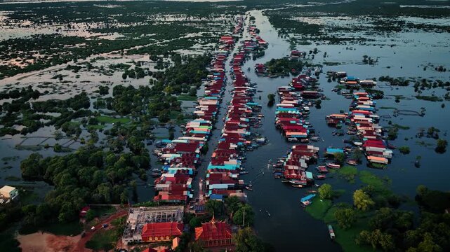 Kampong Phluk floating village with stilt houses on Tonle Sap lake in Cambodia.