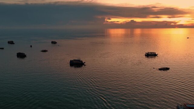 Kampong Phluk floating village with stilt houses on Tonle Sap lake in Cambodia.