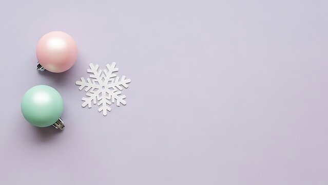 Minimalist christmas flat lay with pastel ornaments and snowflake