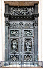 St. Isaac's Cathedral massive bronze gate featuring detailed sculptural reliefs of religious scenes