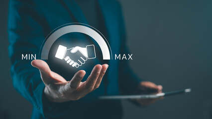 A professional hand gesture showcasing a handshake icon, symbolizing negotiation or agreement, with a focus on minimum and maximum values in a business context.